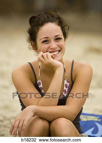 Young woman at the beach. View Large Photo Image Stock Image - Young woman at the beach.. Fotosearch