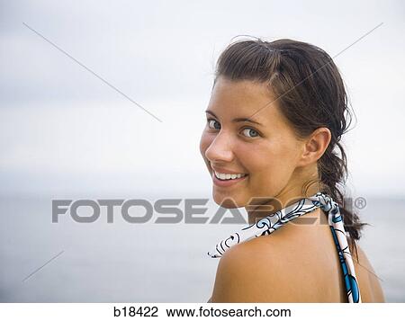 Young woman at the beach. View Large Photo Image Stock Image - Young woman at the beach.. Fotosearch