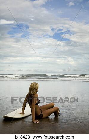 Young woman at the beach. View Large Photo Image Stock Image - Young woman at the beach.. Fotosearch