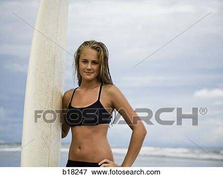 Stock Photo - Young woman at the beach.. Fotosearch