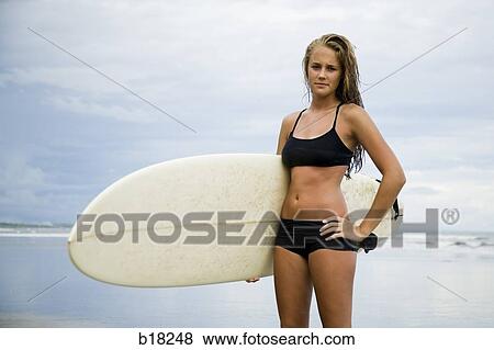 Young woman at the beach. View Large Photo Image Stock Photo - Young woman at the beach.. Fotosearch