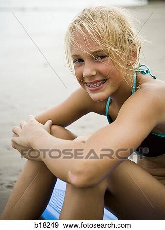 Stock Photo - Young woman at the beach.. Fotosearch