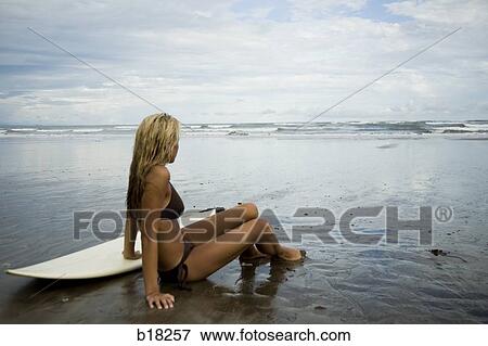 Young woman at the beach. View Large Photo Image Stock Photo - Young woman at the beach.. Fotosearch