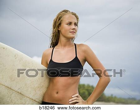 Stock Photograph - Young woman at the beach.. Fotosearch