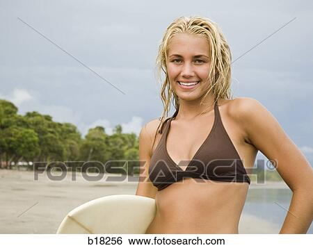 Young woman at the beach. View Large Photo Image Stock Photograph - Young woman at the beach.. Fotosearch