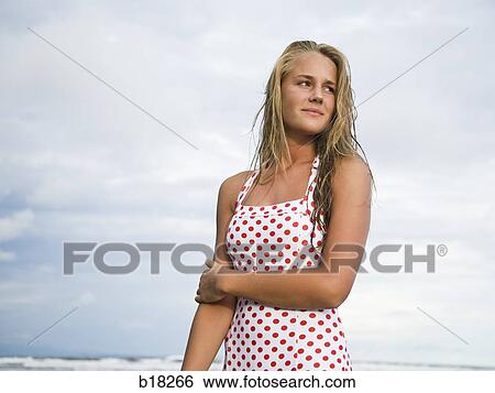 Young woman at the beach. View Large Photo Image Stock Photograph - Young woman at the beach.. Fotosearch