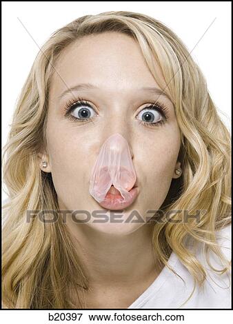 Stock Photo - young woman chewing bubble gum. Fotosearch