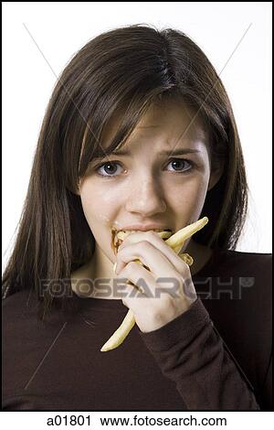 young woman eating junk food View Large Photo Image Stock Image - young woman eating junk food. Fotosearch