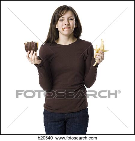 young woman eating junk food View Large Photo Image Stock Image - young woman eating junk food. Fotosearch