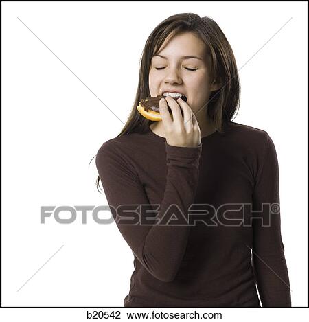 young woman eating junk food View Large Photo Image Stock Image - young woman eating junk food. Fotosearch