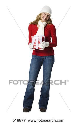 young woman holding a gift. View Large Photo Image Stock Photo - young woman holding a gift.. Fotosearch
