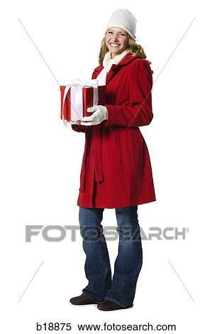 young woman holding a gift. View Large Photo Image Stock Photography - young woman holding a gift.. Fotosearch