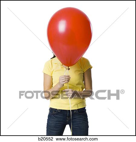 young woman holding a red balloon View Large Photo Image Stock Image - young woman holding a red balloon. Fotosearch