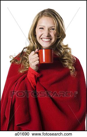 Stock Image - young woman holding a red mug.. Fotosearch