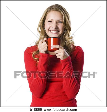 Stock Photograph - young woman holding a red mug.. Fotosearch