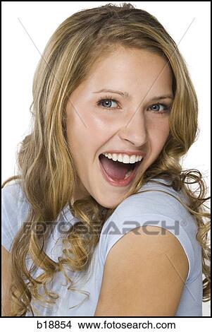 young woman in a gray shirt. View Large Photo Image Picture - young woman in a gray shirt.. Fotosearch