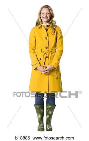 Young woman in a raincoat. View Large Photo Image Stock Photography - Young woman in a raincoat.. Fotosearch