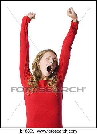 Stock Photography - young woman in pajamas yawning.. Fotosearch
