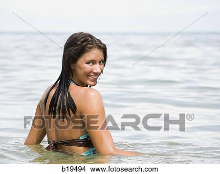 young woman in the water View Large Photo Image Picture - young woman in the water. Fotosearch