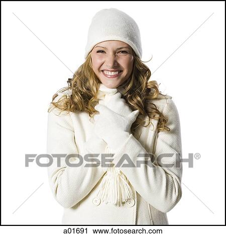 Stock Image - young woman in white winter clothes.. Fotosearch