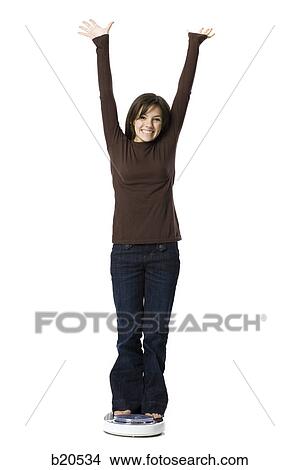 young woman on a scale View Large Photo Image Picture - young woman on a scale. Fotosearch