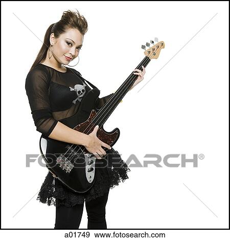 young woman playing a bass guitar View Large Photo Image Stock Photo - young woman playing a bass guitar. Fotosearch