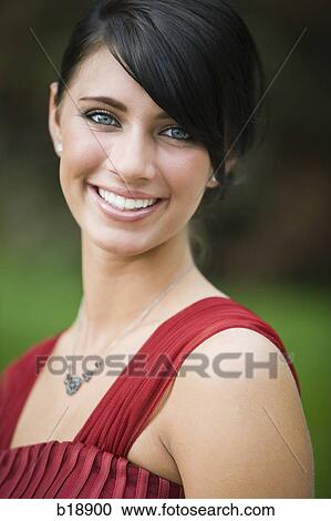 Stock Image - young woman smiling.. Fotosearch