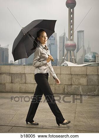 Young woman under an umbrella. View Large Photo Image Stock Photography - Young woman under an umbrella.. Fotosearch