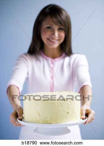 Young woman with a cake. View Large Photo Image Stock Image - Young woman with a cake.. Fotosearch