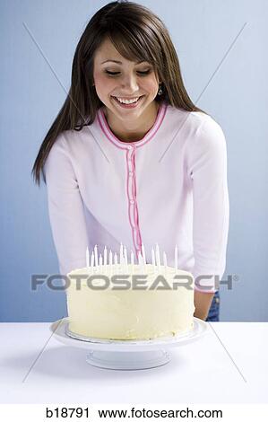 Young woman with a cake. View Large Photo Image Stock Image - Young woman with a cake.. Fotosearch
