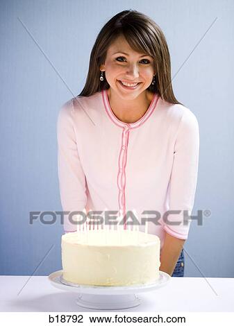 Young woman with a cake. View Large Photo Image Stock Image - Young woman with a cake.. Fotosearch