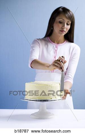 Young woman with a cake. View Large Photo Image Stock Photo - Young woman with a cake.. Fotosearch