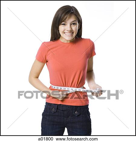 young woman with a measuring tape around her waist View Large Photo Image Stock Image - young woman with a measuring tape around her waist. Fotosearch