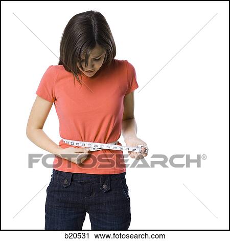 young woman with a measuring tape View Large Photo Image Stock Image - young woman with a measuring tape. Fotosearch
