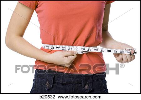 young woman with a measuring tape View Large Photo Image Stock Image - young woman with a measuring tape. Fotosearch