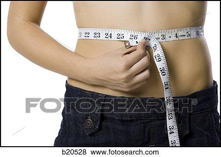 young woman with a measuring tape View Large Photo Image Stock Photo - young woman with a measuring tape. Fotosearch