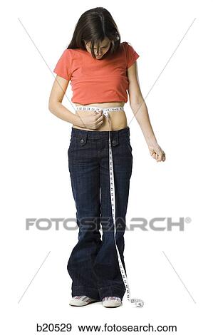 young woman with a measuring tape View Large Photo Image Stock Photo - young woman with a measuring tape. Fotosearch