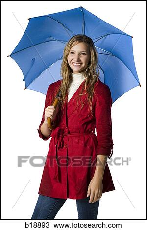 Stock Image - Young woman with an umbrella.. Fotosearch
