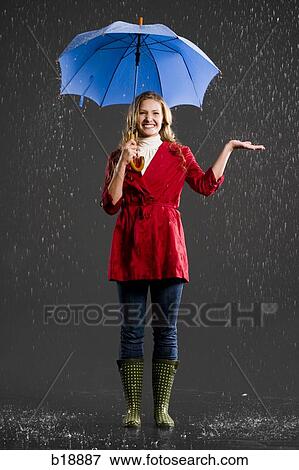 Stock Photo - Young woman with an umbrella.. Fotosearch