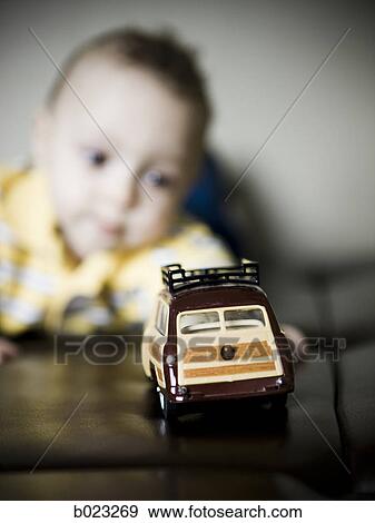 baby boy playing with a toy car View Large Photo Image Stock Photo - baby boy playing with a toy car. Fotosearch