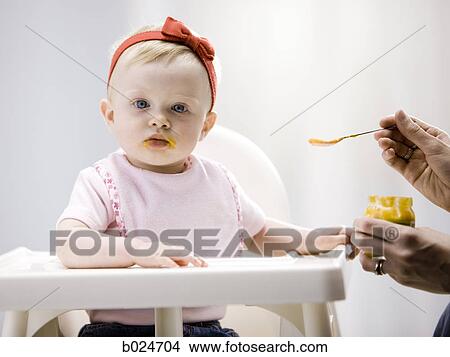 baby girl in a high chair View Large Photo Image Picture - baby girl in a high chair. Fotosearch