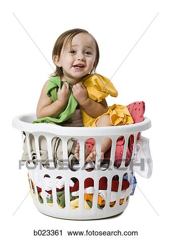 baby girl in a laundry basket View Large Photo Image Stock Image - baby girl in a laundry basket. Fotosearch