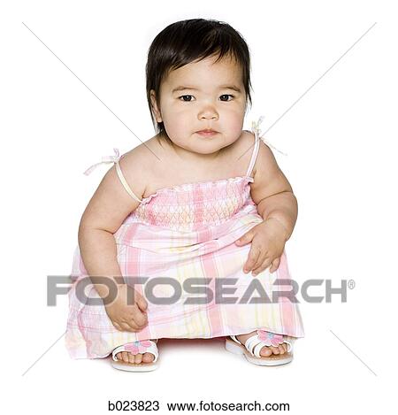 baby girl in a pink dress View Large Photo Image Stock Image - baby girl in a pink dress. Fotosearch