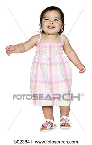 baby girl in a pink dress View Large Photo Image Stock Image - baby girl in a pink dress. Fotosearch