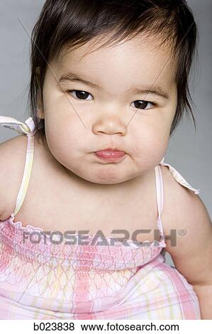 baby girl in a pink dress View Large Photo Image Stock Photo - baby girl in a pink dress. Fotosearch