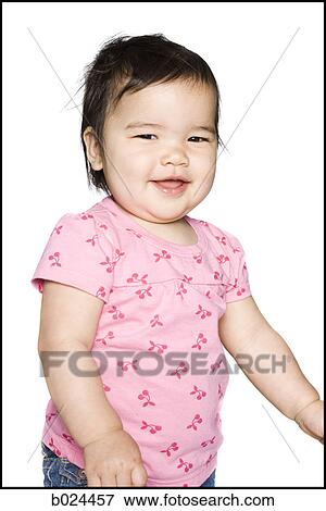 baby girl in a pink t-shirt View Large Photo Image Stock Photo - baby girl in a pink t-shirt. Fotosearch