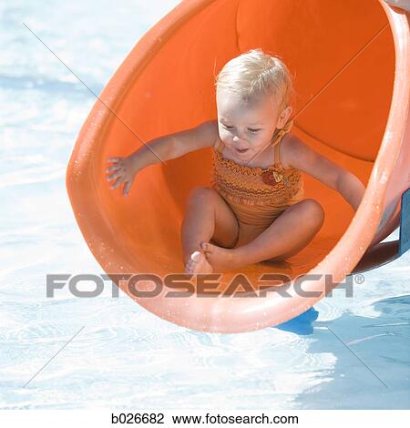 baby girl playing on a waterslide View Large Photo Image Stock Image - baby girl playing on a waterslide. Fotosearch