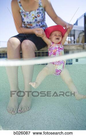 Stock Photo - baby in a swimming pool. Fotosearch