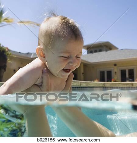 baby in a swimming pool View Large Photo Image Stock Photograph - baby in a swimming pool. Fotosearch