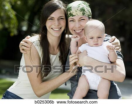 baby with her mother and aunt View Large Photo Image Stock Image - baby with her mother and aunt. Fotosearch
